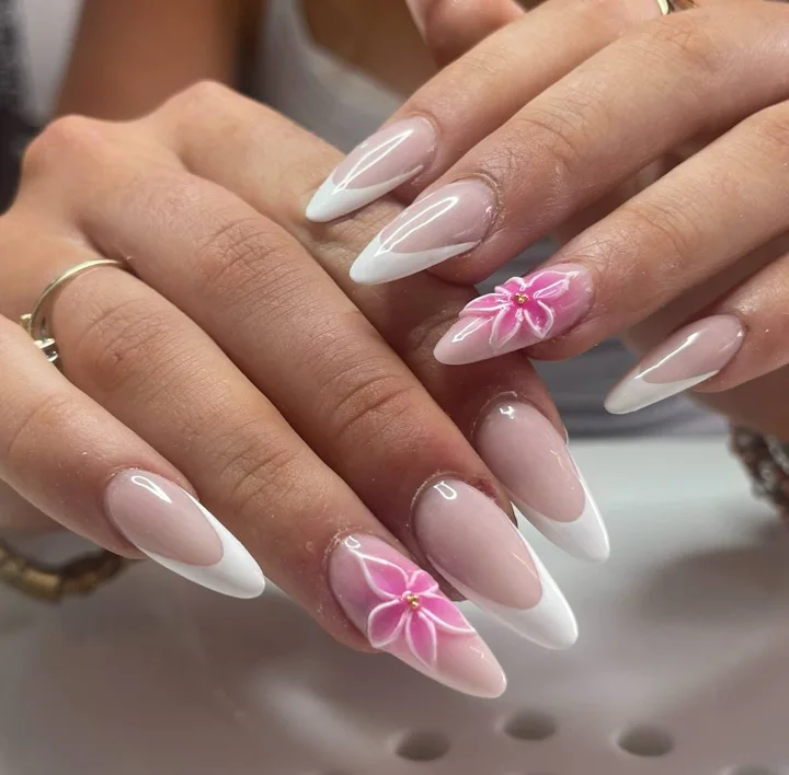 White almond French tips with sculpted pink flowers by Muskoka Nails & Spa