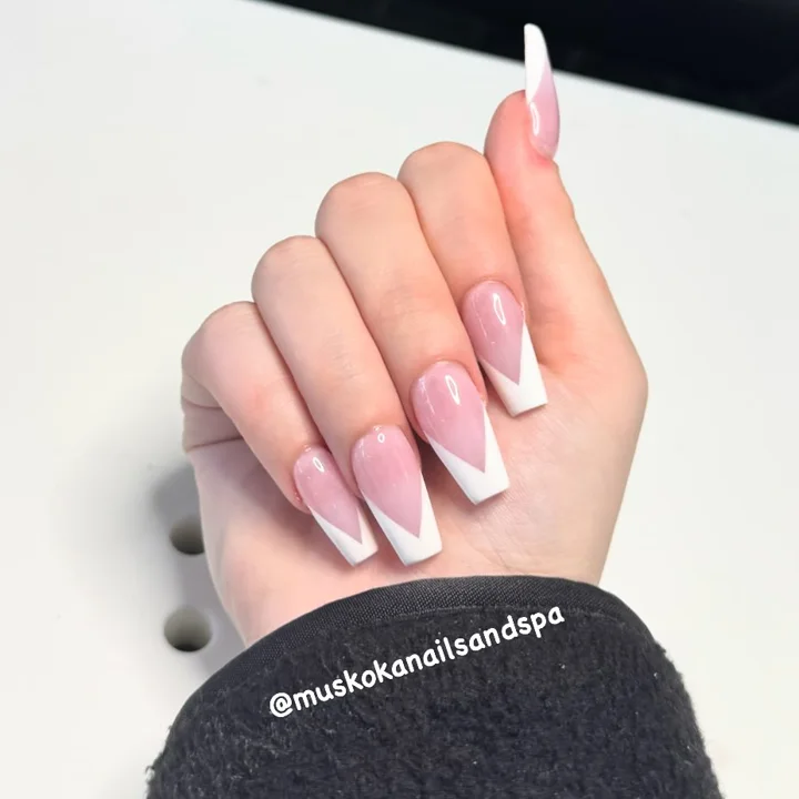Pink square nails with angled white French tips by Muskoka Nails & Spa