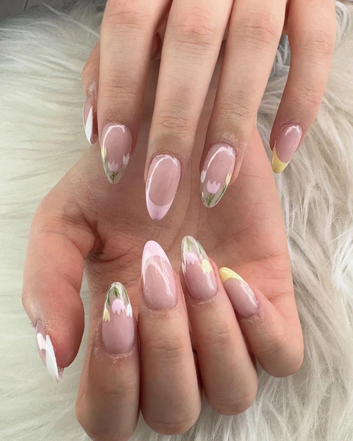 Pink almond nails with pastel tips and hand-painted tulips by Muskoka Nails & Spa
