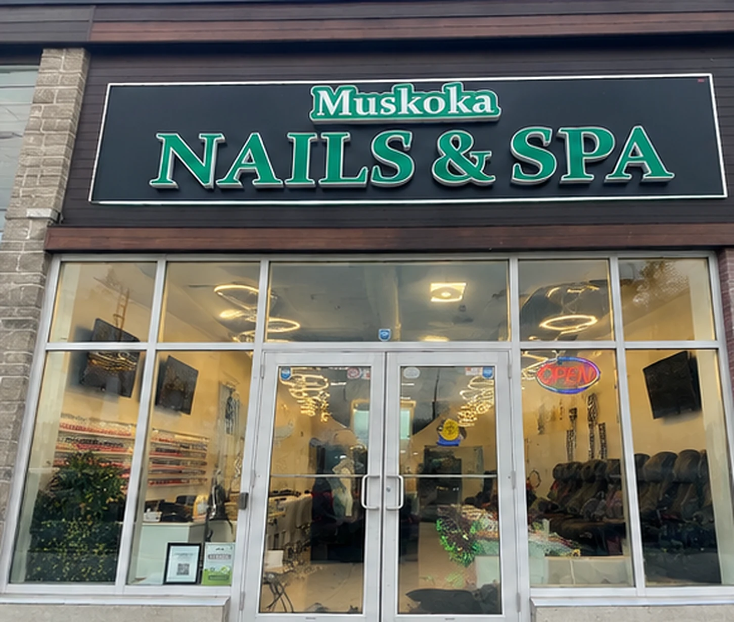 Complete Muskoka Nails and Spa storefront and green sign at 17 Hanes Road